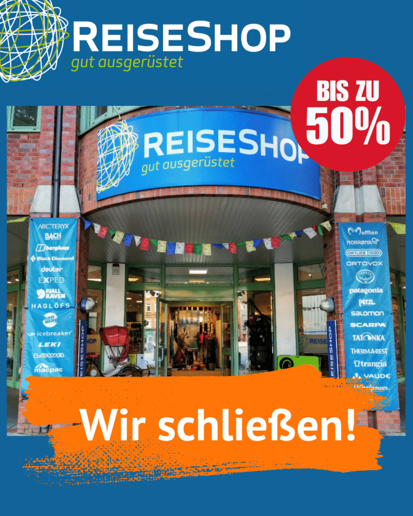 Eingang vom ReiseShop, unten steht: Wir schließen.